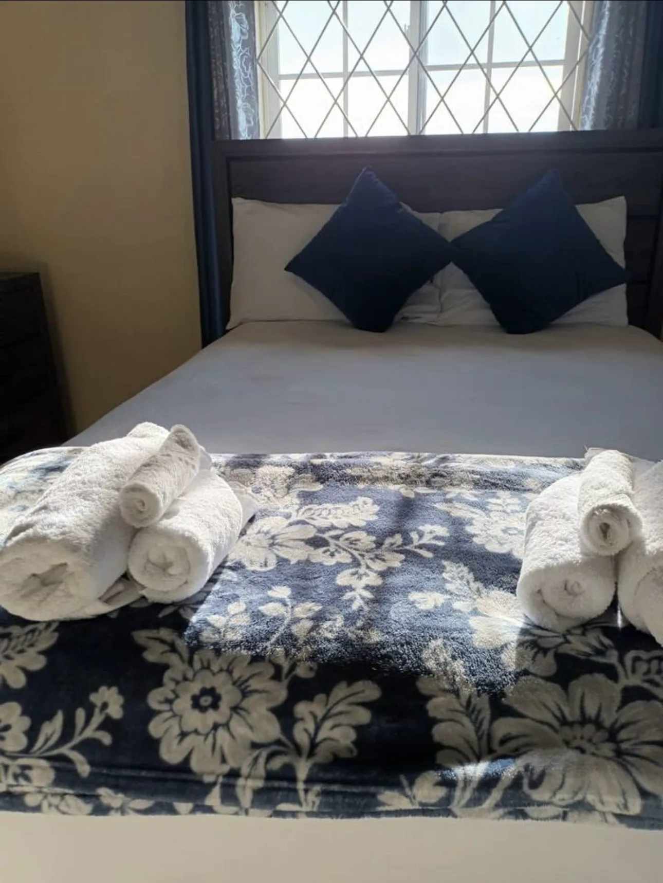 Guest-ready bed with towels